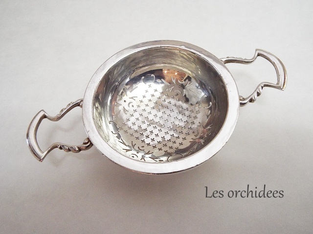 silver tea strainer with saucer