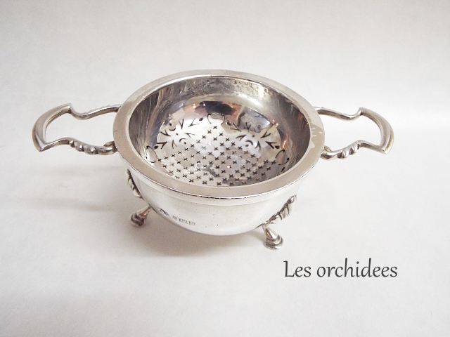 silver tea strainer with saucer